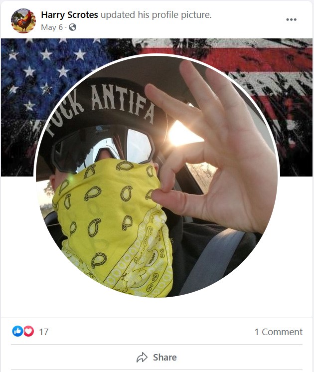 Travis Erickson wears opaque shades, a "fuck antifa" hat, and a yellow bandana in a screenshot from his Facebook profile.