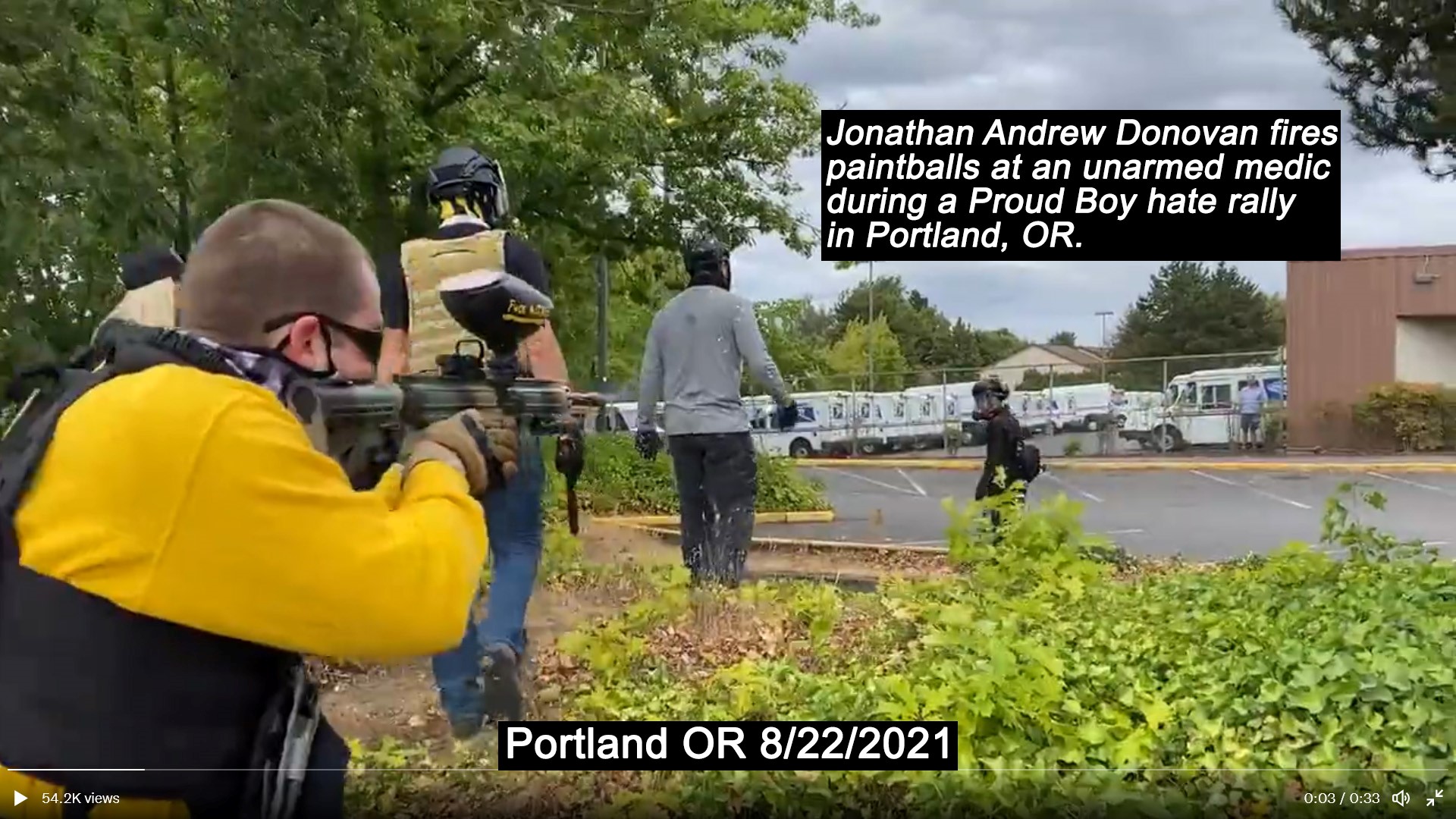 Jonathan Donovan is seen in the foreground shooting his paintball gun at a fleeing medic in Portland. 